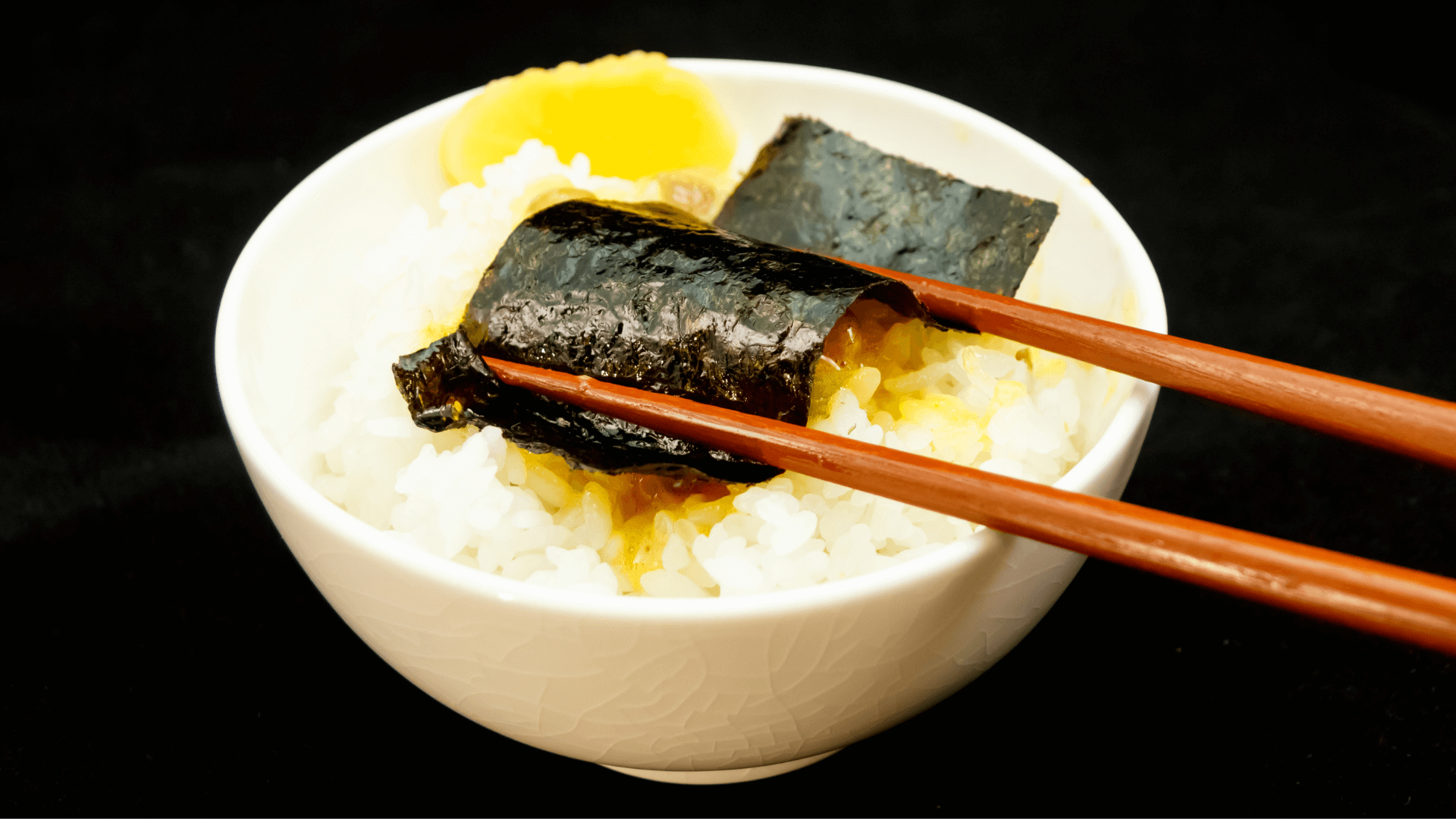 A Bowl of Rice with Dried Seaweed, Egg and Japanese Fermented Soy Beans Dried Seaweed, Egg and Stringy, Sticky Bean Goodness